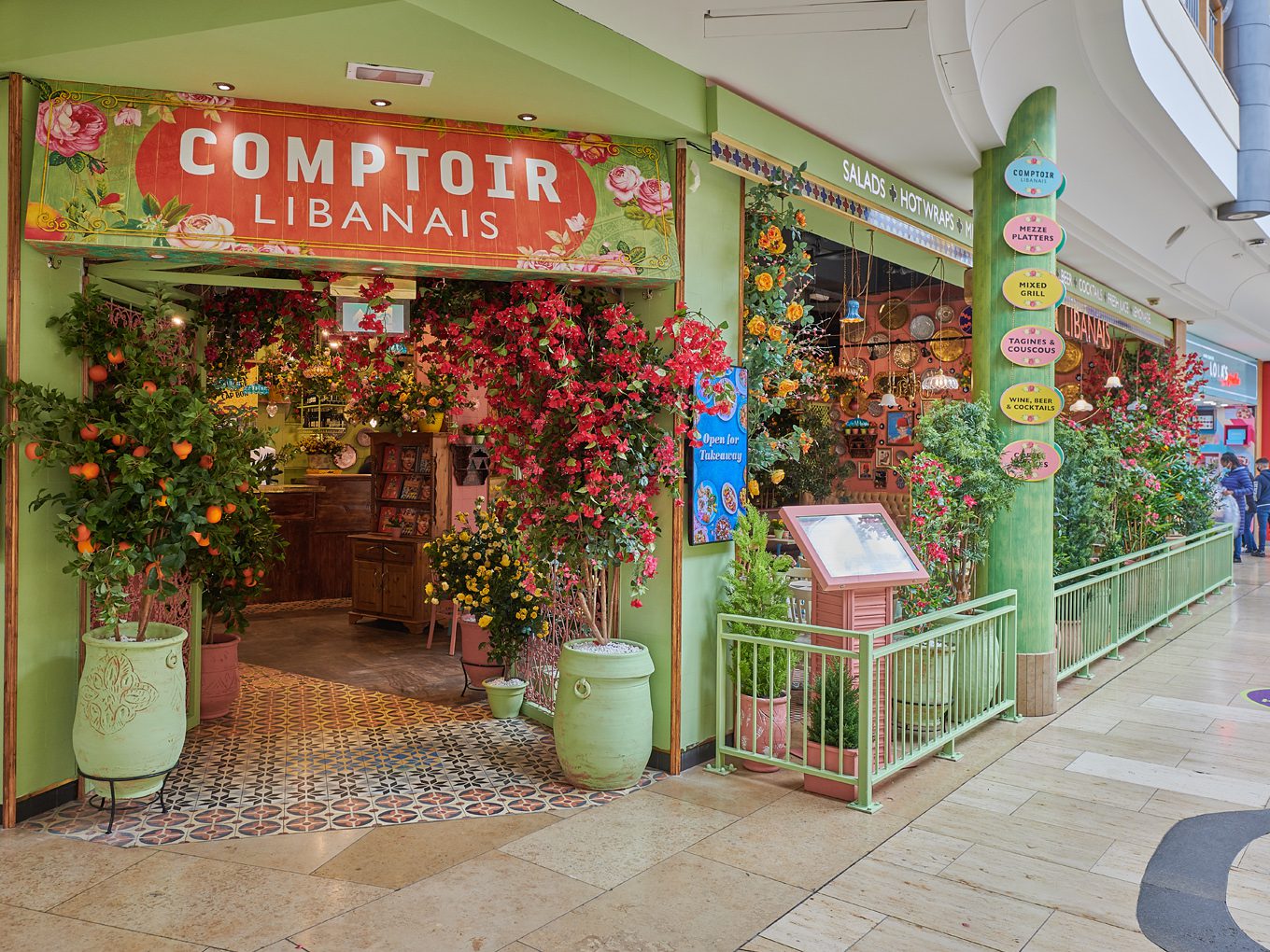 restaurant comptoir libanais entrance with flowers
