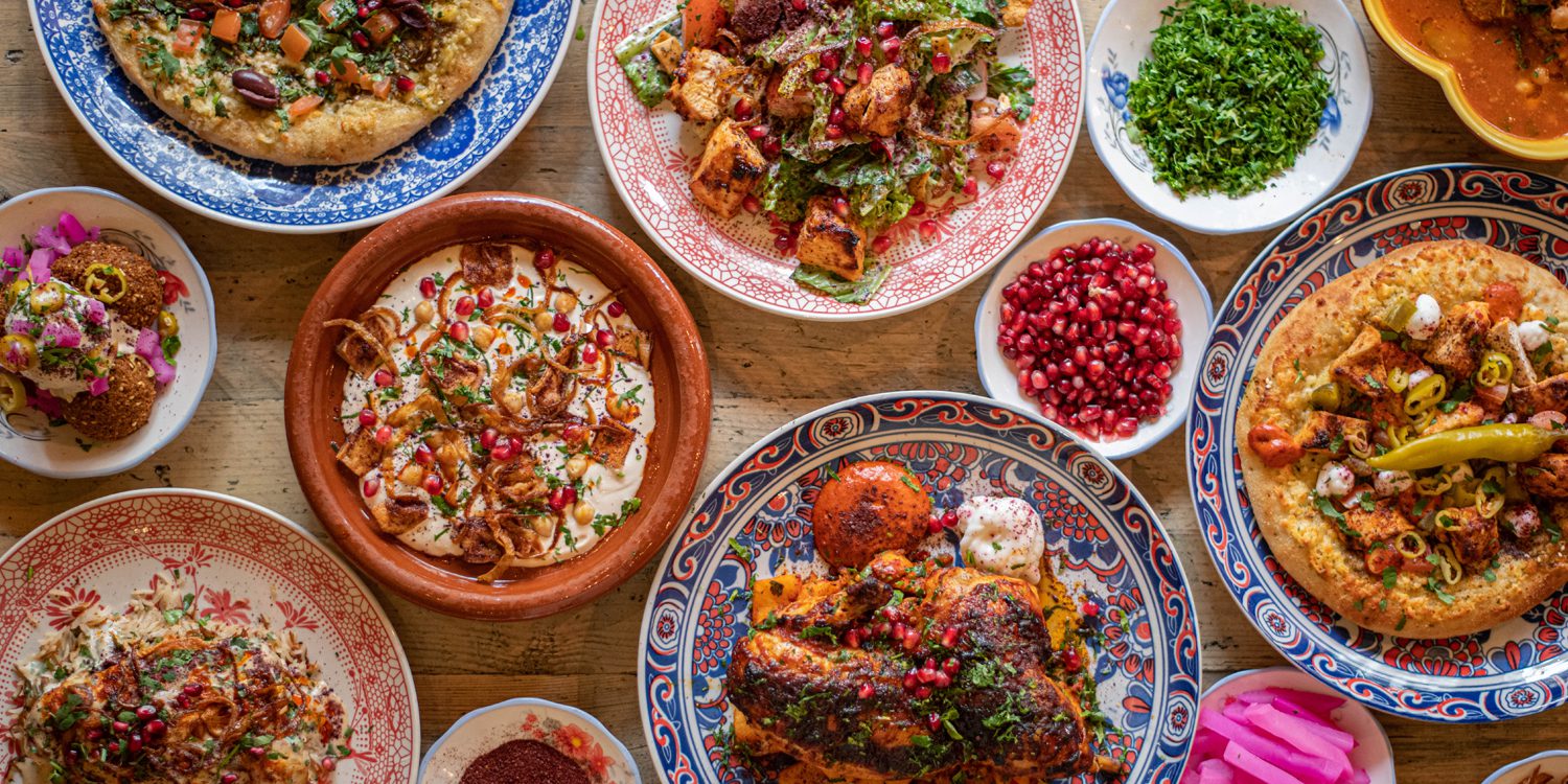 table with variety of colourful lebanese dishes